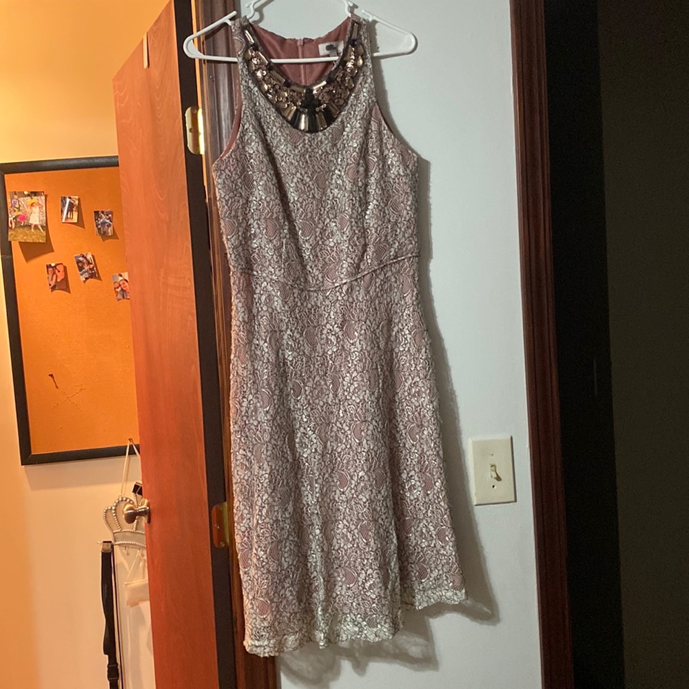 The brand is Lovely by Adrianna Papell. It’s a size 12. It’s purple with lace